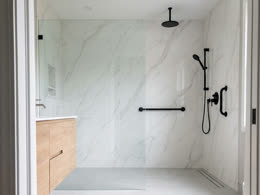 Walk-in shower in white marble