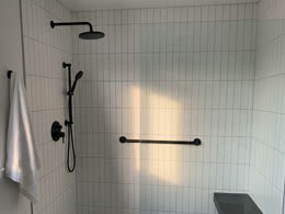 White tiled walk-in shower